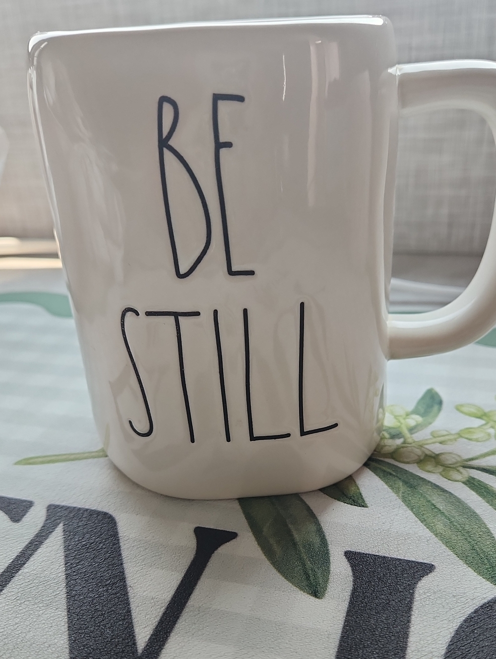 Rae Dunn White 'BE STILL' Ceramic Mug with Black Lettering